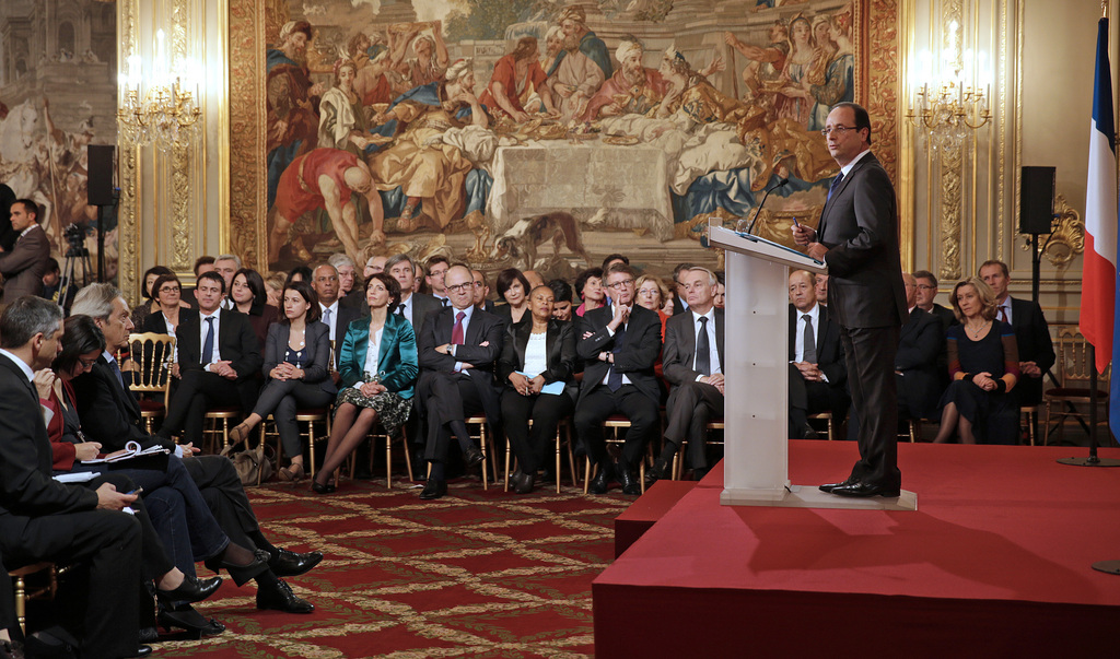 French President Francois Hollande, right, addresses reporters during a press conference held at the Elysee Palace in Paris, Tuesday Nov. 13, 2012.(AP Photo/Philippe Wojazer/Pool)