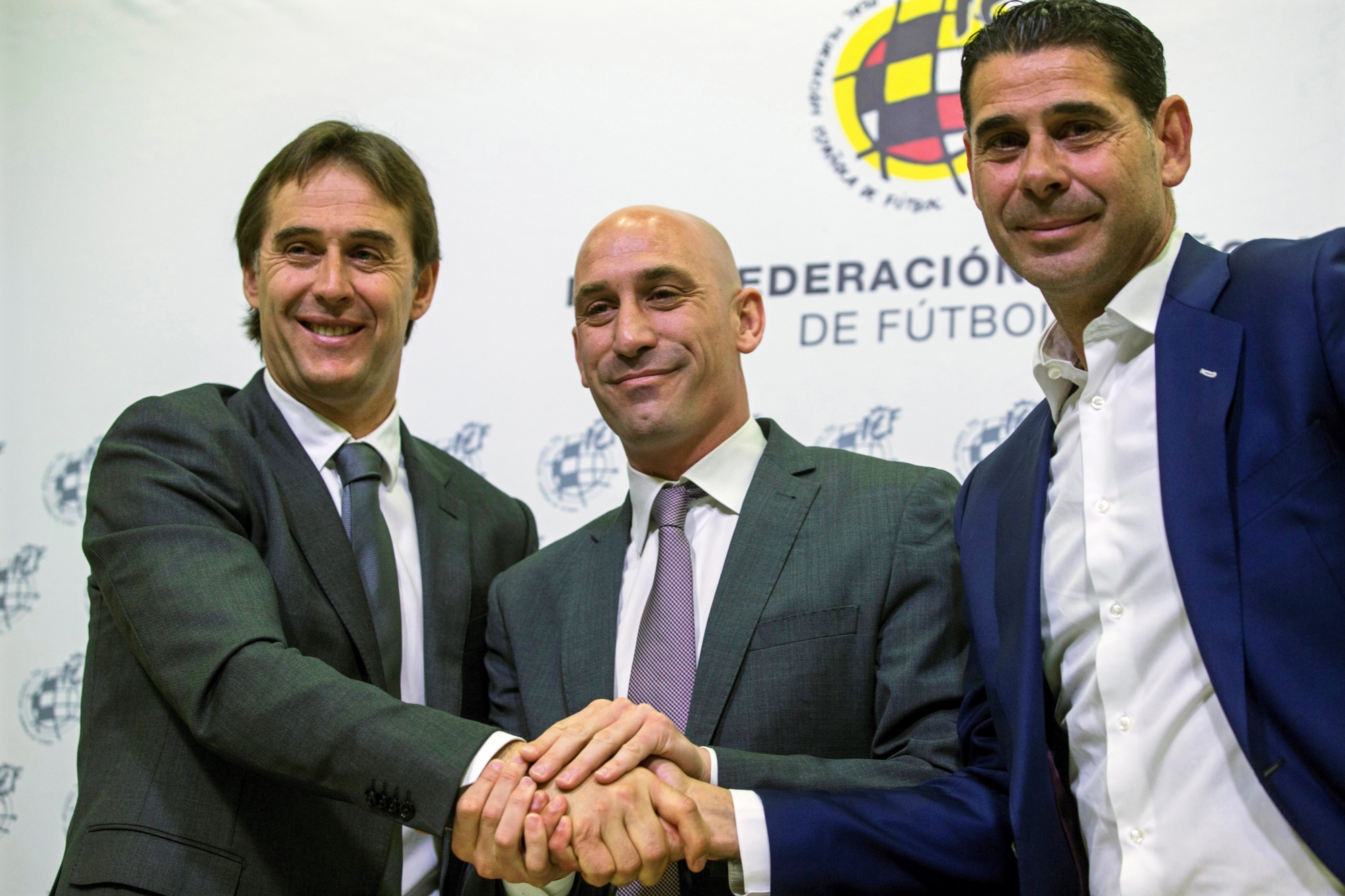 epa06804727 (FILE) - Spanish national soccer team head coach Julen Lopetegui (L) poses for photographers with Luis Rubiales (C), new president of the Royal Spanish Football Federation (RFEF), and RFEF sports director Fernando Hierro (R) after extending his contract in Las Rozas, Madrid, Spain, 22 May 2018 (re-issued 13 June 2018). Rubiales confirmed on 13 June 2018 that Lopetegui has been sacked as national coach one day after agreeing to take over Real Madrid. Hierro will take charge of the Spanish team during the FIFA World Cup 2018.  EPA/RODRIGO JIMENEZ (FILE) SPAIN SOCCER LOPETEGUI