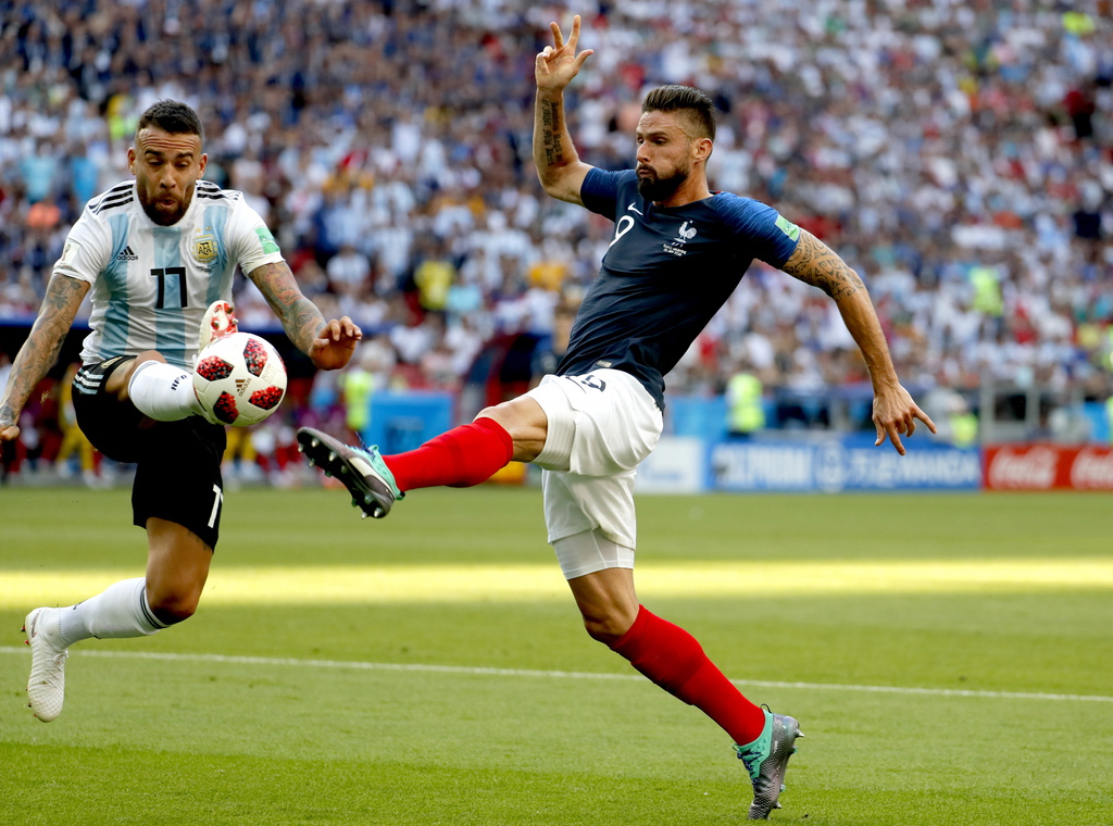 epa06851951 Olivier Giroud of France (RL) and Nicolas Otamendi of Argentina in action during the FIFA World Cup 2018 round of 16 soccer match between France and Argentina in Kazan, Russia, 30 June 2018.....(RESTRICTIONS APPLY: Editorial Use Only, not used in association with any commercial entity - Images must not be used in any form of alert service or push service of any kind including via mobile alert services, downloads to mobile devices or MMS messaging - Images must appear as still images and must not emulate match action video footage - No alteration is made to, and no text or image is superimposed over, any published image which: (a) intentionally obscures or removes a sponsor identification image; or (b) adds or overlays the commercial identification of any third party which is not officially associated with the FIFA World Cup)  EPA/YURI KOCHETKOV   EDITORIAL USE ONLY  EDITORIAL USE ONLY