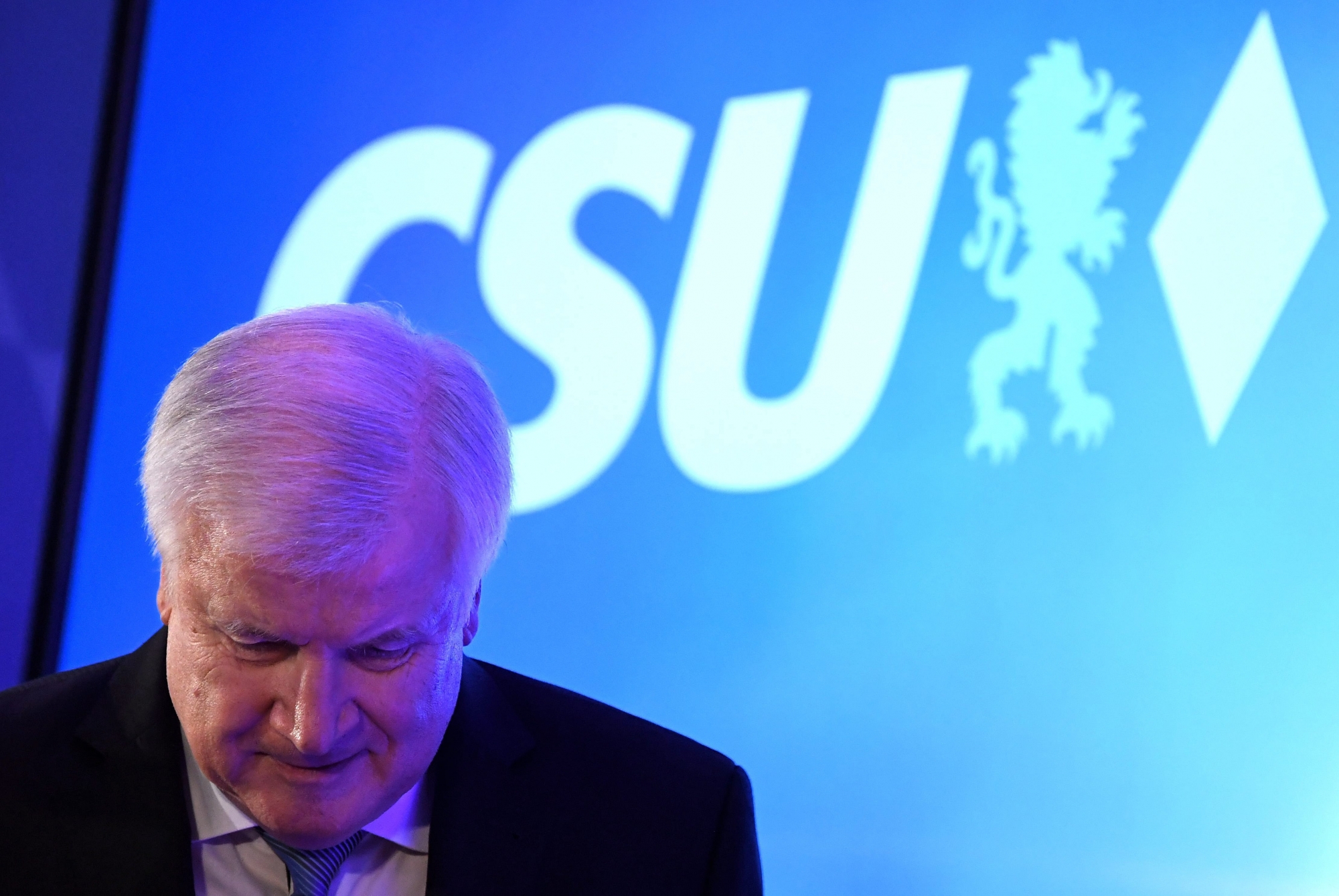 epa07093088 German Minister of Interior, Construction and Homeland and Christian Social Union (CSU) party chairman Horst Seehofer speaks to supporters during the Bavaria state elections in Munich, Germany, 14 October 2018. According to the Bavarian state election commissioner some 9.5 million people were eligible to vote in the regional elections for a new parliament in the southern German state of Bavaria. According to first initial exit polls Christian Social Union  (CSU) party received 35.5 percent of votes.  EPA/CLEMENS BILAN GERMANY ELECTIONS BAVARIA