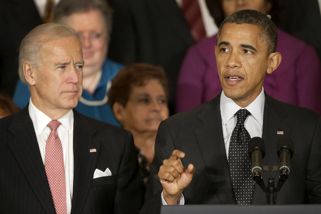 President Barack Obama, accompanied by Vice President Joe Biden, gestures as he speaks about the economy and the deficit, Friday, Nov. 9, 2012, in the East Room of the White House in Washington. (AP Photo/Pablo Martinez Monsivais)