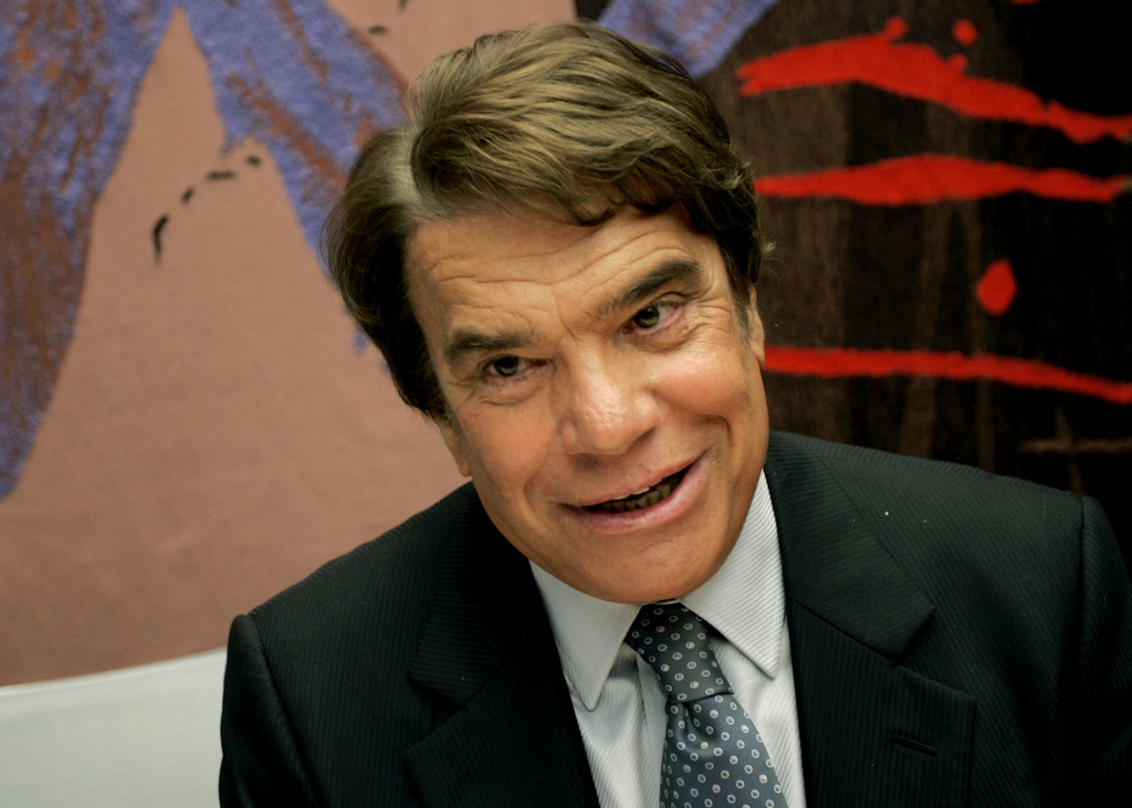 Bernard Tapie attends a meeting at the financial commission of the National Assembly in Paris, Wednesday Sept. 10, 2008. A decision awarded 285 million euros ($ 449 million) to maverick businessman Tapie as compensation for the mishandling of the 1990's sale of sportswear maker Adidas. The case had dragged on for 14 years amid various legal twists and turns, with Tapie _ a former government minister, sports tycoon and actor _ arguing that he had been defrauded out of millions in the sale. (AP Photo/Thibault Camus)
