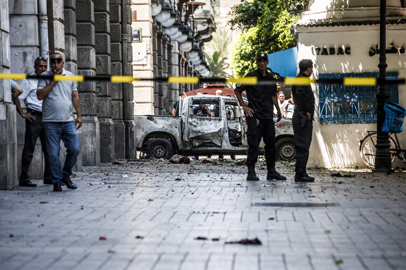 epa07677022 Police take measures at the scene after a suicide bombing targeted a police vehicle in the Tunisian capital in Tunis on 27 June  2019. according to media reports, two suicide bomb attacks near the French embassy and in the main street in the city of Tunis targeted a police patrol cars, both area's close to the shopping center, which was targeted by a female suicide bomber last October 2018. At least 2 people killed and multiple others injured.  EPA/STR TUNISIA SUICIDE BOMBING