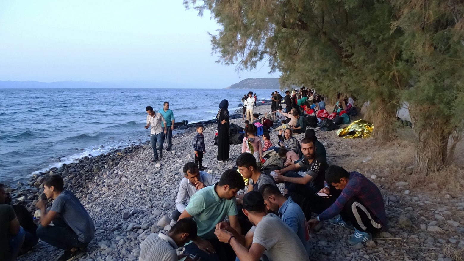 epa07803513 Migrants, who arrived on 13 boats, at Skala Sikamias, Lesvos Island, Greece, 29 August 2019 (issued 30 August 2019). A total of 547 people landed on the island, including 177 men, 124 women and 246 children. Of these, 193 were transferred to the Moria Reception and Identification Center and the rest remained at the UNHCR camp in Sykamia, the so-called 'stage 2' camp, with the prospect of being transferred to Moria for registration on 30 August. According to reports, two Coast Guard vessels are operating in the area.  EPA/STRATIS BALASKAS GREECE MIGRATION