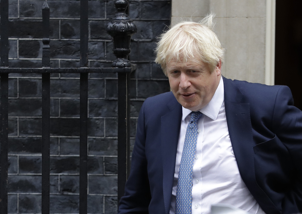 Britain's Prime Minister Boris Johnson leaves 10 Downing Street in London, Thursday, Sept. 26, 2019. An unrepentant Prime Minister Boris Johnson brushed off cries of "Resign!" and dared his foes to try to topple him Wednesday at a raucous session of Parliament, a day after Britain's highest court ruled he acted illegally in suspending the body ahead of the Brexit deadline. (AP Photo/Kirsty Wigglesworth)