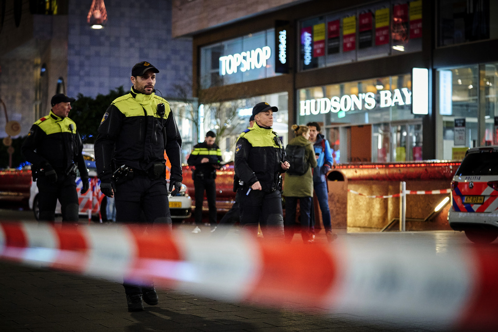 Dutch police secure a shopping street after a stabbing incident in the center of The Hague, Netherlands, Friday, Nov. 29, 2019. Dutch police say multiple people have been injured in a stabbing incident in The Hague's main shopping street. (AP Photo/Phil Nijhuis)