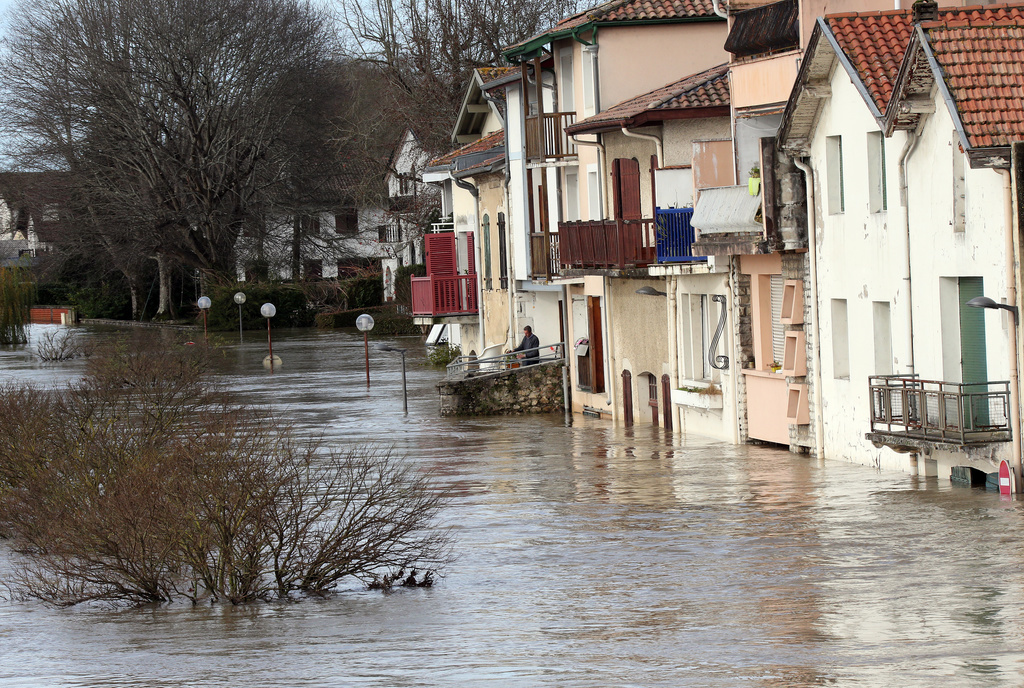 A view of flooded houses, in Peyrorade, southwestern France, caused by heavy rains, Saturday, Dec. 14, 2019. Southwestern France is on alert for violent storms, high winds and floods. (AP Photo/Bob Edme)